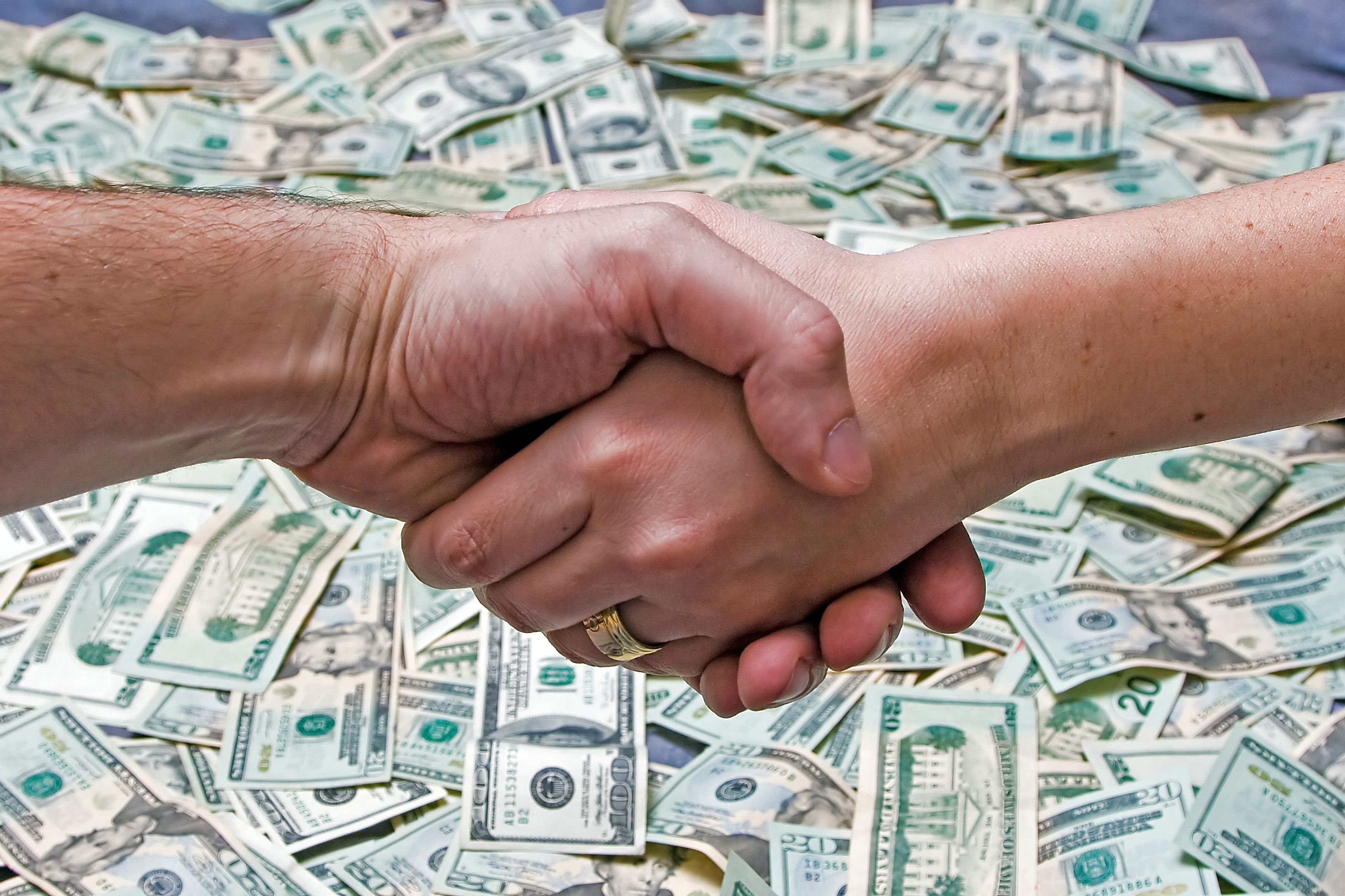 handshake-over-money